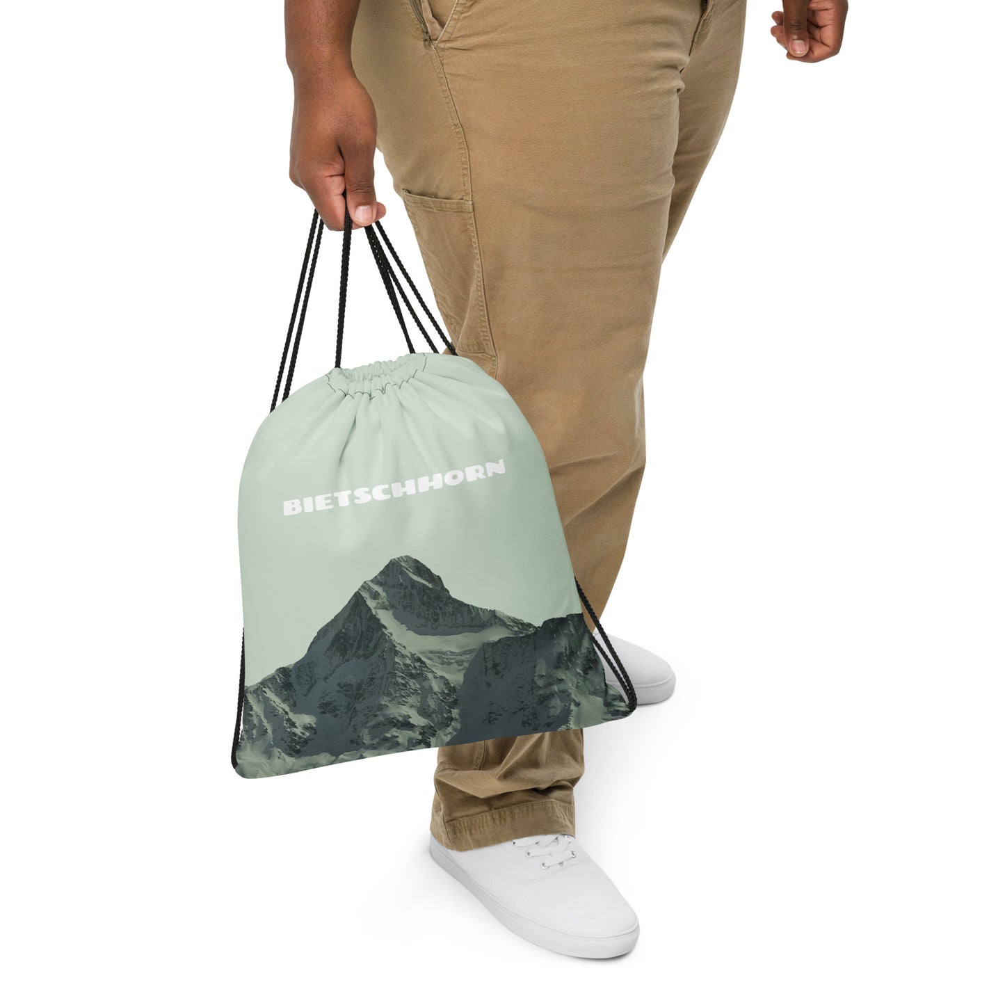 Hellgrüner Gym Bag mit Bietschhorn getragen an der Kordel.